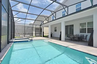 a swimming pool in a house with a glass ceiling at Casa 7Q perto da Disney com Piscina e Games in Kissimmee