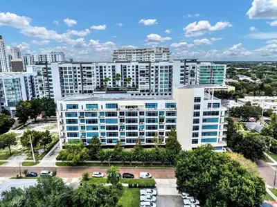 an aerial view of a large building in a city at Extra Large 1 Bdrm Condo & Gym in Orlando