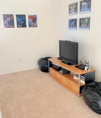 a room with a television and two bean bags at Grand Cumbrian - Four Bedroom Home in Kissimmee