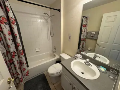 a bathroom with a sink and a toilet and a shower at Casablanca Villa in Kissimmee
