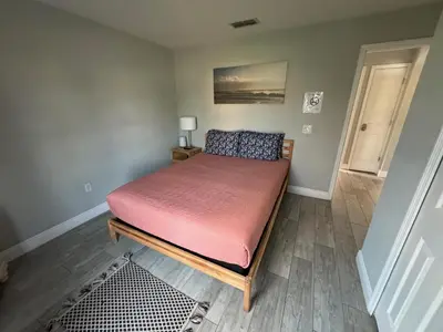 a bedroom with a bed with a red mattress at Casablanca Villa in Kissimmee