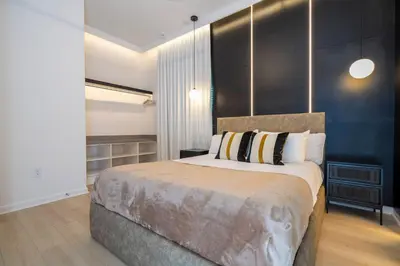 a bedroom with a large bed with a black wall at Brand New 12-bedroom Amazing house 5869 in Orlando