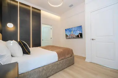 a bedroom with a king sized bed in a room at Brand New 12-bedroom Amazing house 5869 in Orlando