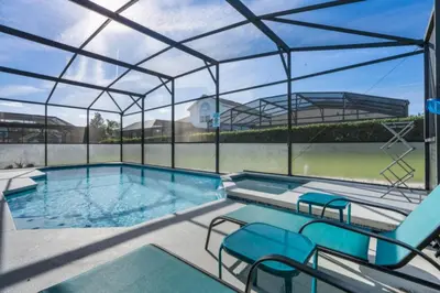 a large swimming pool with a glass roof at Windsor Palms Oasis Harry Potter Mickey Pool Spa in Kissimmee