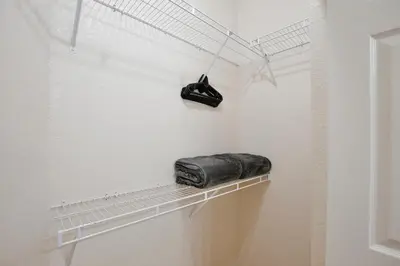 a towel is sitting on a shelf in a bathroom at New in the market apt with big terrace! in Orlando