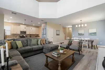 a living room with a couch and a table at Amazing 5Bdrms At Storey Lake in Kissimmee