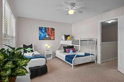 a bedroom with two bunk beds and a ceiling fan at Sweet 3 bedroom Townhome 2407 in Orlando