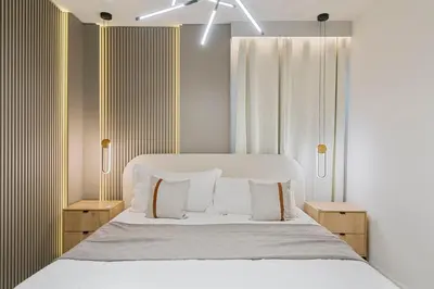 a bedroom with a bed with white sheets and pillows at 5911 Luxury 10BD Family Home For an Unforgettable Vacation in Orlando