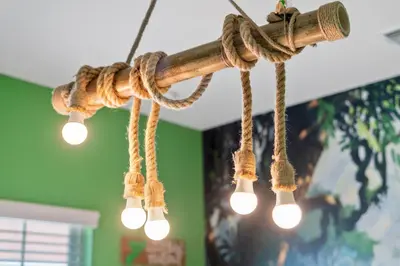 a rope chandelier with lights hanging from a ceiling at Luxury Design with close proximity to DISNEY in Kissimmee