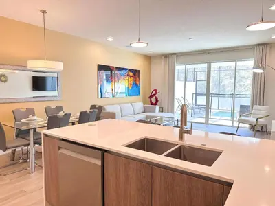 a kitchen and living room with a sink and a living room at TR1459SL - Brand new Star Wars property with pool in Orlando
