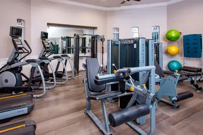 a fitness room with treadmills and cardio machines at Dream 4814 Condo At Vista Cay in Orlando