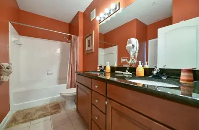 a bathroom with a sink and a shower and a toilet at Resort Condo with all amenities needed-Cane Island in Kissimmee