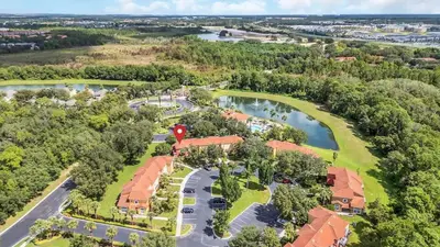 an aerial view of a resort with a lake at Townhome Perfectly Located Near Clubhouse in Kissimmee