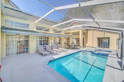 an indoor swimming pool with a patio and a swimming house at Lindfields Reserve with Private Pool in Kissimmee