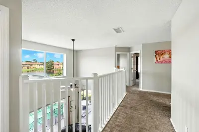 a staircase in a house with a window at Wonderful Terra Verde Orlando Vacation Home in Kissimmee