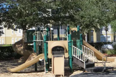 a playground with a slide in a park at Newly Remodel Kitchen with All New Appliances in Kissimmee