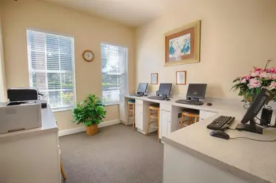 an office with three desks with computers on them at Newly Remodel Kitchen with All New Appliances in Kissimmee