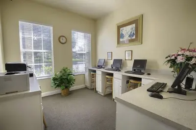 an office with two desks with two computers on them at Beautiful Vacation Condo at Windsor Palms Resort in Kissimmee