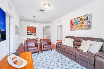 a living room with a couch and chairs and a table at Cozy 3BR Apartment - Vista Cay Resort near Disney! in Orlando