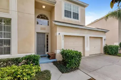 a house with a garage in front of it at Olivia's Dream Villa on WindsorHills in Orlando