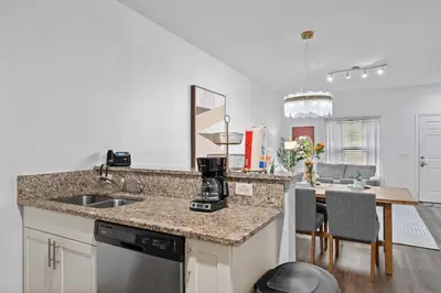 a kitchen with a sink and a counter top at Modern 3 Bed Villa Newly Renovated Prime Location in Kissimmee