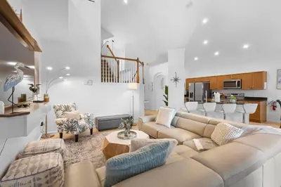 a living room with a couch and a table at Lux 6BrVilla -Pool&ResortAmenities -10mins to Parks in Kissimmee