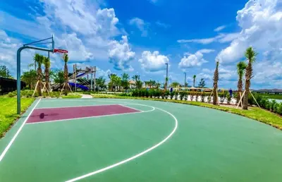 a basketball court at a park with palm trees at Storey Lake Resort 2bd Condo Overlooking Water #840 condo in Kissimmee
