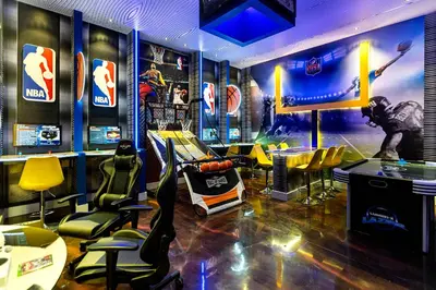 a sports bar with yellow chairs and a game room at Brand NEW 9Bedrooms9Bathrooms At Paradiso Grande in Orlando