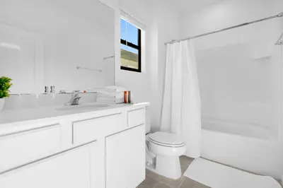 a white bathroom with a sink and a toilet at Brand NEW 9Bedrooms9Bathrooms At Paradiso Grande in Orlando