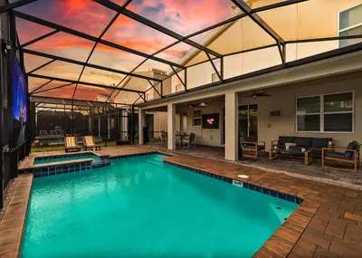 an indoor swimming pool with a large ceiling at 9 min to Disney w Pool ARCADE FREE Waterpark Villa in Kissimmee