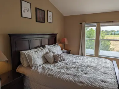 a bedroom with a bed with pillows and a window at La Dolce Vita Gated resort in Orlando