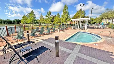 a swimming pool with lounge chairs at Villas Standard Seven Dwrafs Resort - Close to Disney in Kissimmee