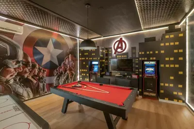 a room with a pool table and a video game at 5 Bedroom 5 Bathroom Paradiso Grande 10352 in Orlando