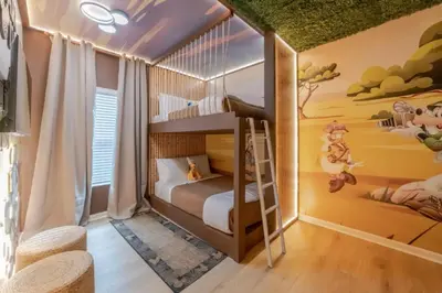a childs room with a bunk bed and a mural at 5 Bedroom 5 Bathroom Paradiso Grande 10352 in Orlando