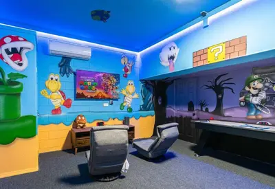 a kids room with a cartoon themed wall at Magical 6BR Family Retreat with Pool Near Disney in Orlando
