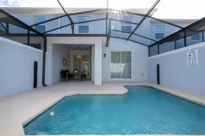 a swimming pool in a house with a ceiling at 2557 Awesome Family 4BD Townhouse located at Storey Lake in Kissimmee