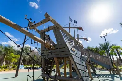 a slide at a park with the sky in the background at 2557 Awesome Family 4BD Townhouse located at Storey Lake in Kissimmee