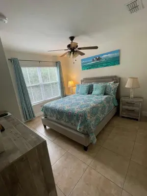 a bedroom with a bed and a ceiling fan at Venetian Bay Villages in Kissimmee