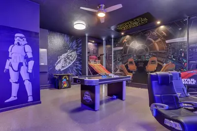 a room with a ping pong table and a gaming room at Free Water Park Luxury Living in Orlando