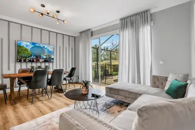 a living room with a couch and a table at Windsor Hills Water Park Adventure Home in Orlando