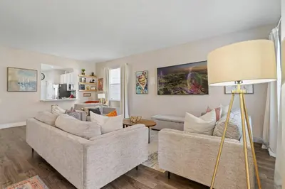 a living room with two couches and a lamp at 6BR Fun in the Sun with FREE water park in Orlando