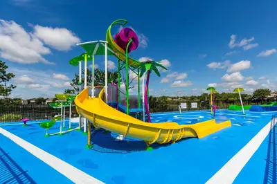 a playground with a slide in a swimming pool at Windsor Hills Condo: Water Park Included in Orlando