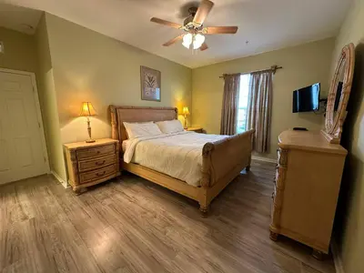 a bedroom with a bed and a ceiling fan at Delight Condo Water Park Near Disney Parks in Orlando