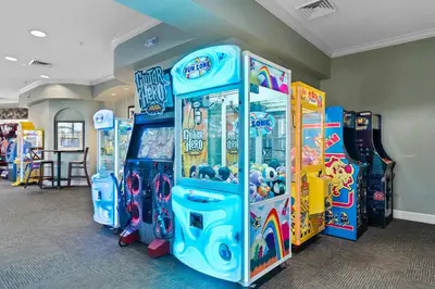 a row of arcade games in a room at Delight Condo Water Park Near Disney Parks in Orlando