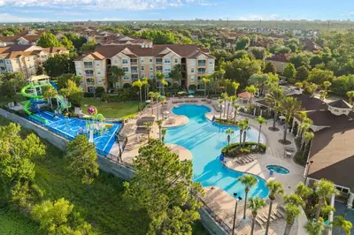 an aerial view of a pool at a resort at Water Park Haven: Spacious 3BR Windsor Hills in Orlando