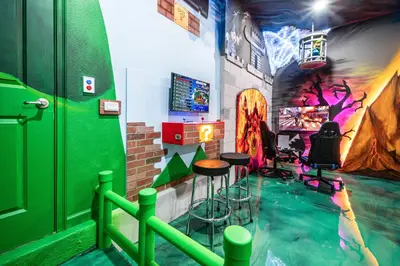 a room with a pool in the middle of a gaming room at Luxury Meets Adventure 8BR Condo with Themed Rooms in Orlando
