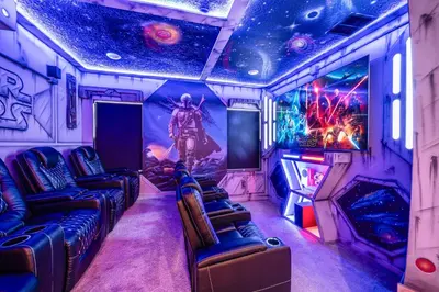 a room with a star wars room with chairs and a tv at Luxury Meets Adventure 8BR Condo with Themed Rooms in Orlando
