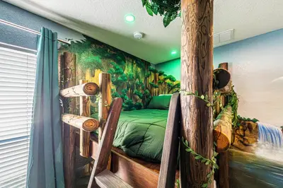 a room with a bed with a painting on the wall at NEW Spectacular Home Windsor Hills in Orlando