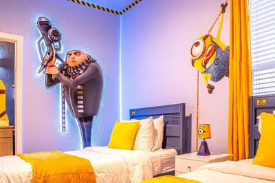 a bedroom with two beds and clowns on the wall at NEW Spectacular Home Windsor Hills in Orlando