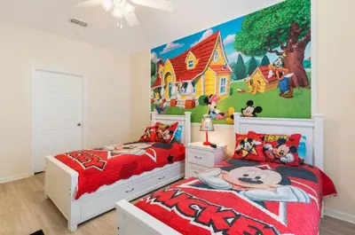 a bedroom with two beds and a mural on the wall at Windsor Hills Getaway: Condo with Water Park in Orlando